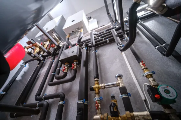 Modern electric boiler room in the house. Equipment for water heating system with automatic control unit